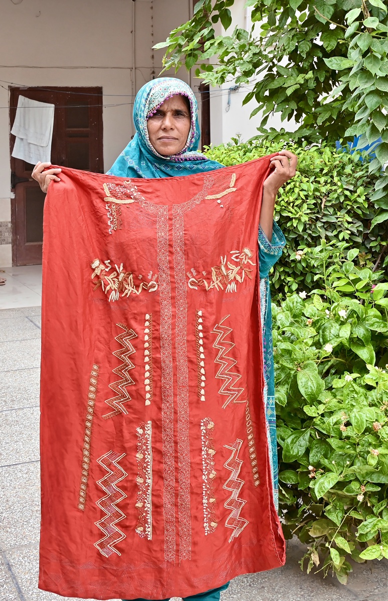 Embroidery by Rubina Javed Pakistan women artisan of Kaarvan Crafts Foundation for Omar's collection Meluhas.